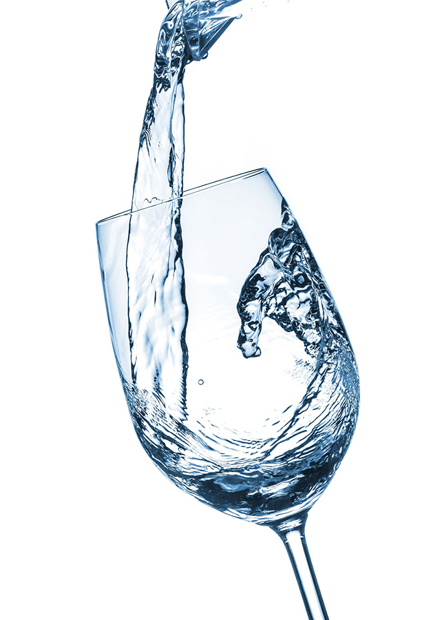 19265021 – pouring water on a glass on white background